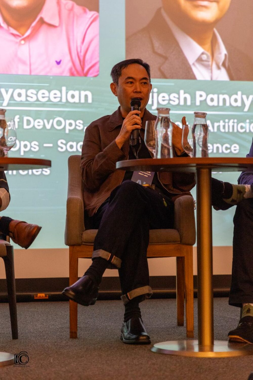 Gibson Tang speaking on a panel at Singapore DevOps Conference 2026